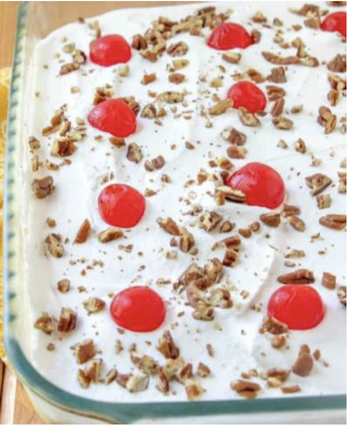 Doreen's Four Layer dessert with red cherries and walnuts on top