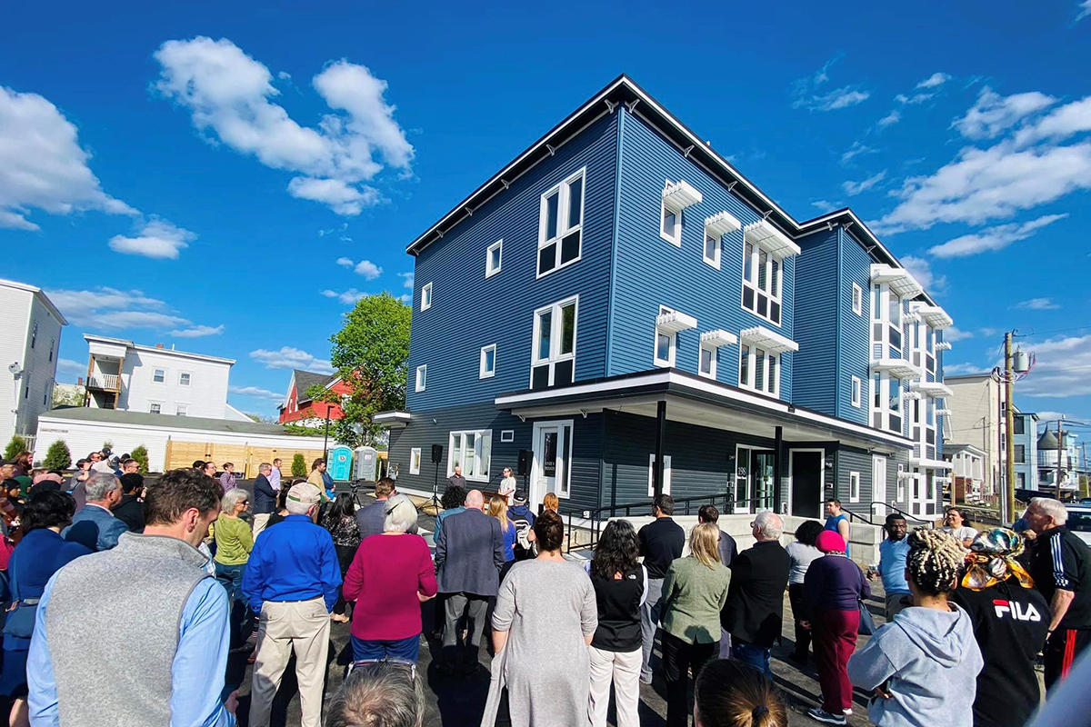Evernorth project in Maine - apartment building with people outside